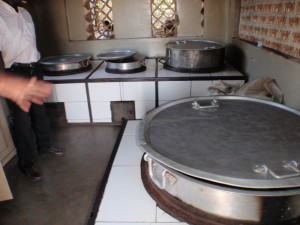 The kitchen is in a brick building. so cooking can be indoors